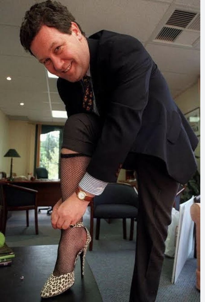 Alexander downer in fish net stocking. 