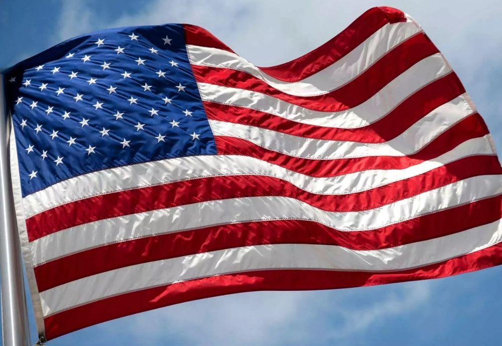 An American flag flapping in the full gale of freedom from tyranny. 