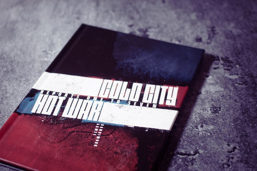The unique, one-off, Cold City Hot War Reports One to Seven book, lying on a concrete surface. 