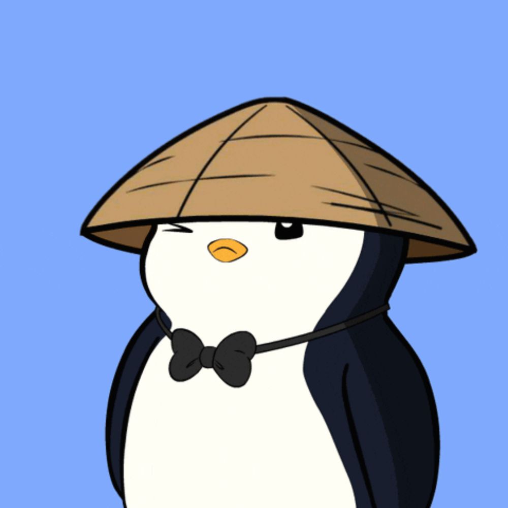 a penguin wearing a hat and bow tie