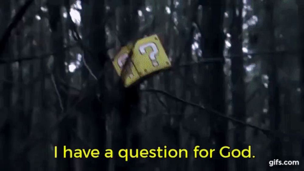 two men dressed as mario and luigi are standing next to each other in a forest and talking .