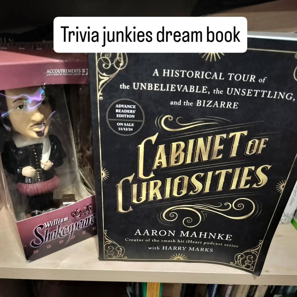 Shakespeare bobblehead next to Cabinet of Curiosities book by Aaron Mahnke