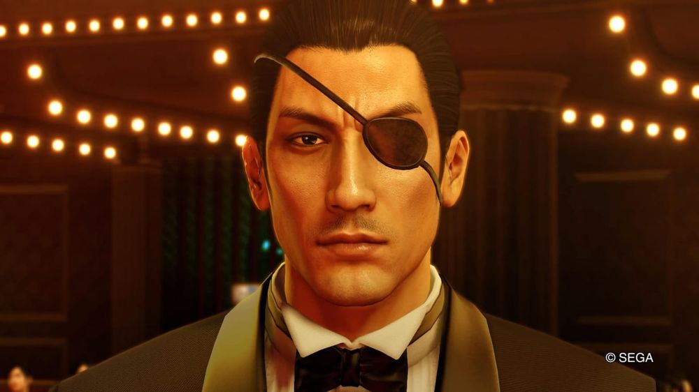 A screenshot of Yakuza 0. Goro Majima is looking penetratingly with a patch on his left eye.