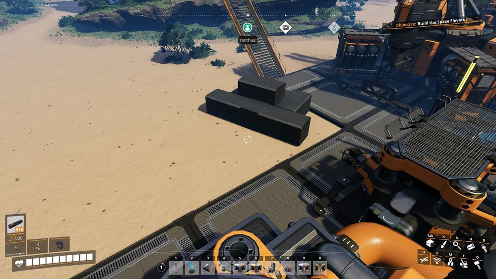 A screenshot of Satisfactory: a small shrimp dog sized tomb made out of small metal pillars on the sands next to a fuel-powered generator.