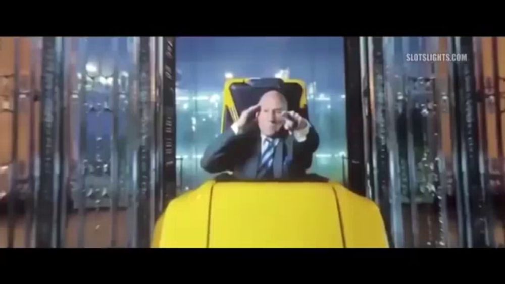 a man in a suit and tie is sitting in a roller coaster .