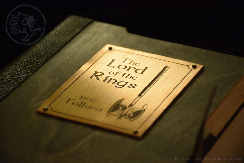 A close-up on the copper title plate, featuring an axe inspired by Gimli's battleaxe.