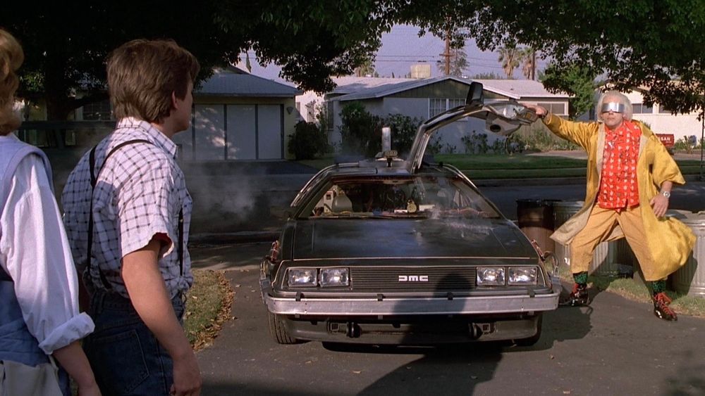 A still from the movie "Back to the Future" featuring the DeLorean time machine.