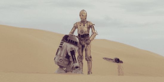 R2-D2 and C-3P0 on the sands of Tatooine. 