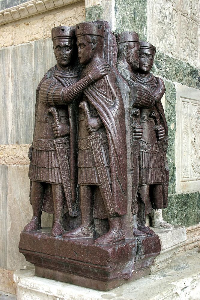 The Four Tetrarchs, a porphyry sculpture sacked from the Byzantine Philadelphion palace in 1204, on a corner of Saint Mark's in Venice, next to the "Porta della Carta" 