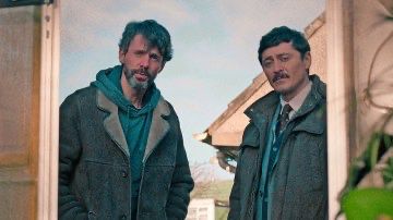 Photo shows two lead actors from the show "Dept. Q," a British police procedural.