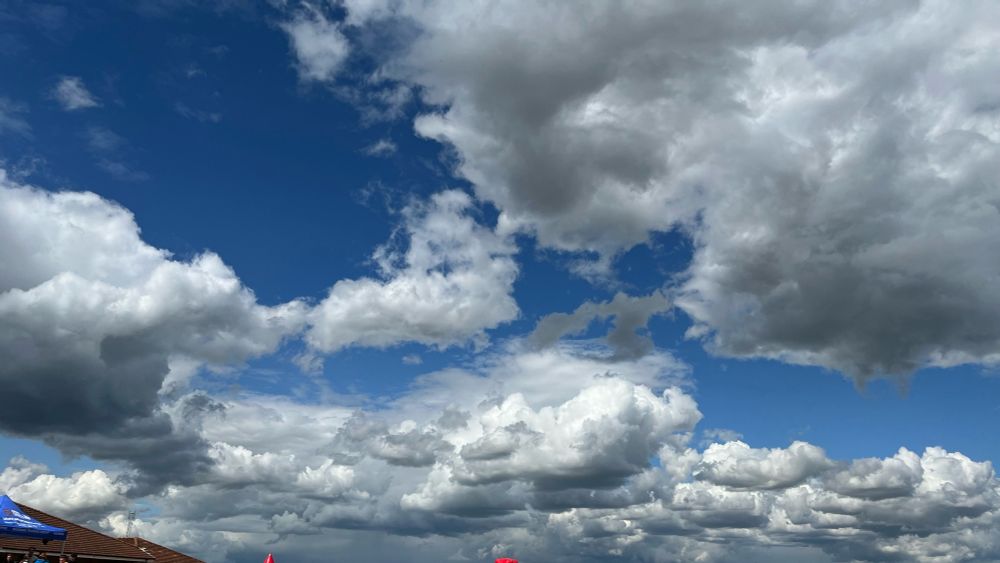 even more sky, pretty much same as the previous image but with a roof just in frame on the bottom left