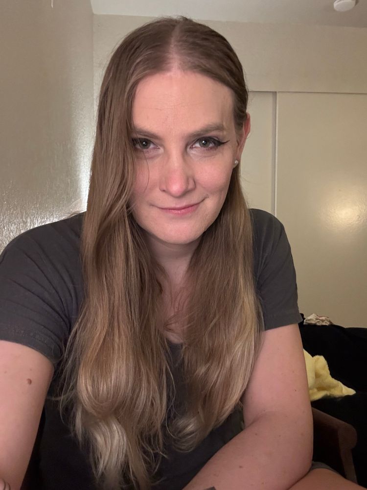 Rose taking a selfie with glam ish makeup wearing a cozy dress wishing you a happy Saturday 