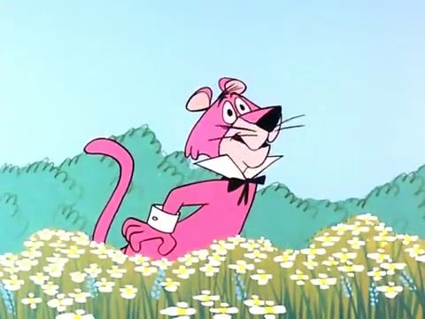Snagglepuss is standing in a field of yellow flowers, holding on to his rear end with one hand. He has a surprised and uncomfortable look on his face, as though something just stung or bit him on his rear.