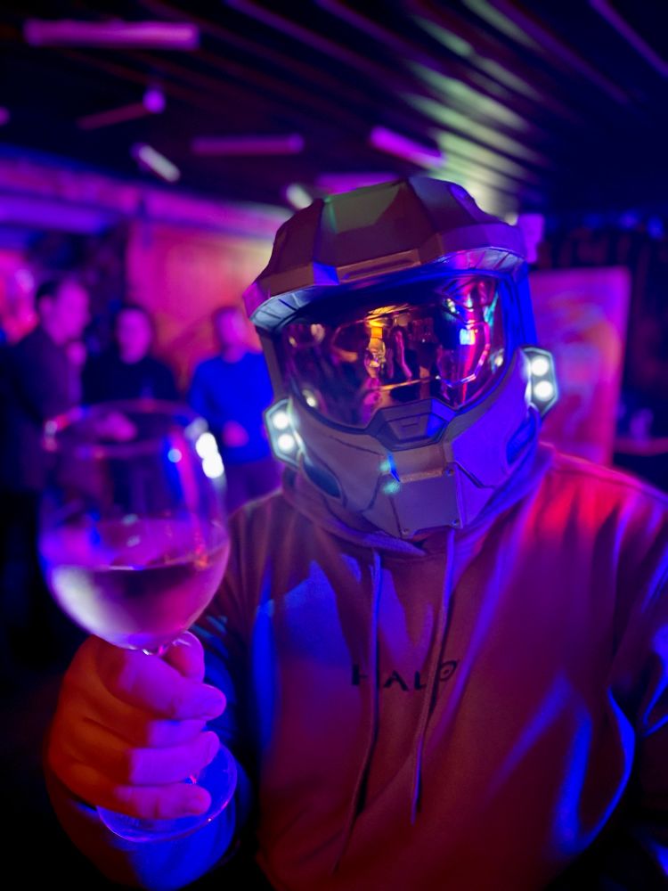 photo of me in a master chief helmet, holding a wine glass up, toasting to the camera.