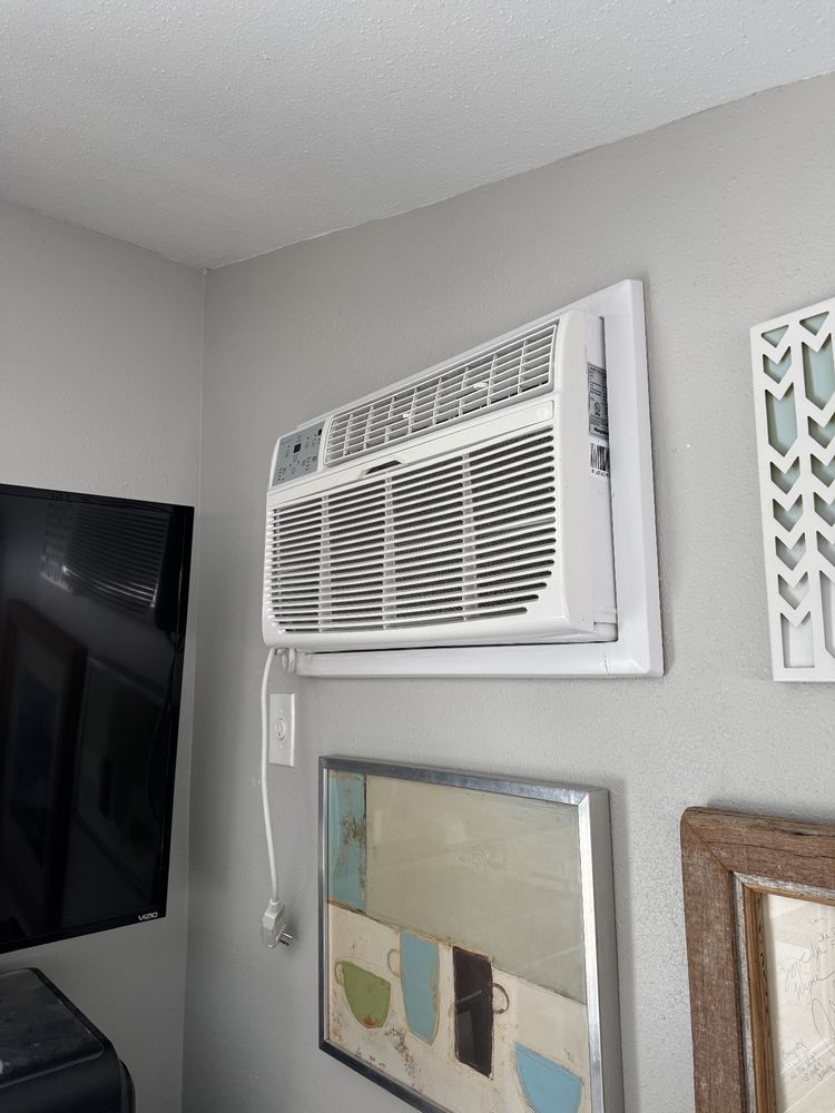 Photo of an unplugged through-the-wall AV unit.
