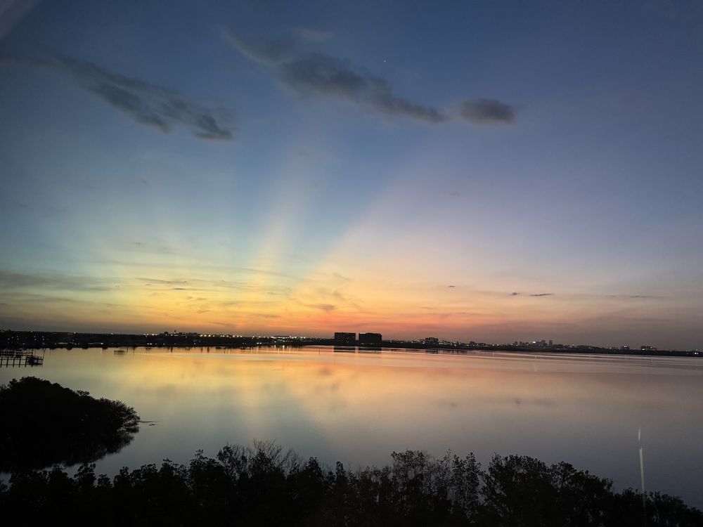 Photo of a sunrise over Tampa bay from our hotel room window.
