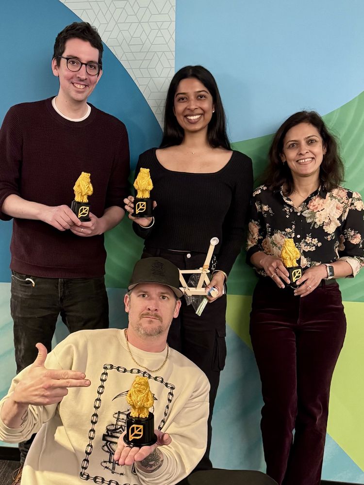 The winning team of 4 from the catapult building game with their Ewok trophies.