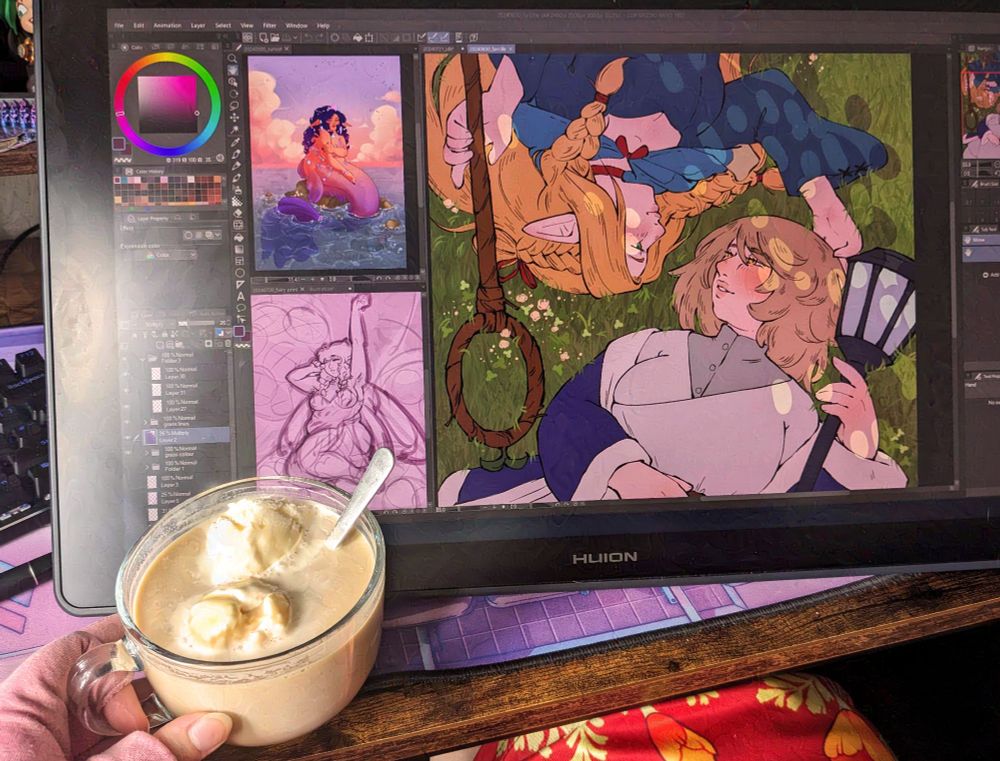 A picture of a drawing tablet screen with a hand holding an ice cream coffee peeking in at the bottom. There are three drawings on the tablet, the two smaller ones being a fully rendered mermaid and a sketch of a fairy, but the biggest part is of two women laying in grass with their heads on the same level. They are Falin and Marcille from Delicious in Dungeon.