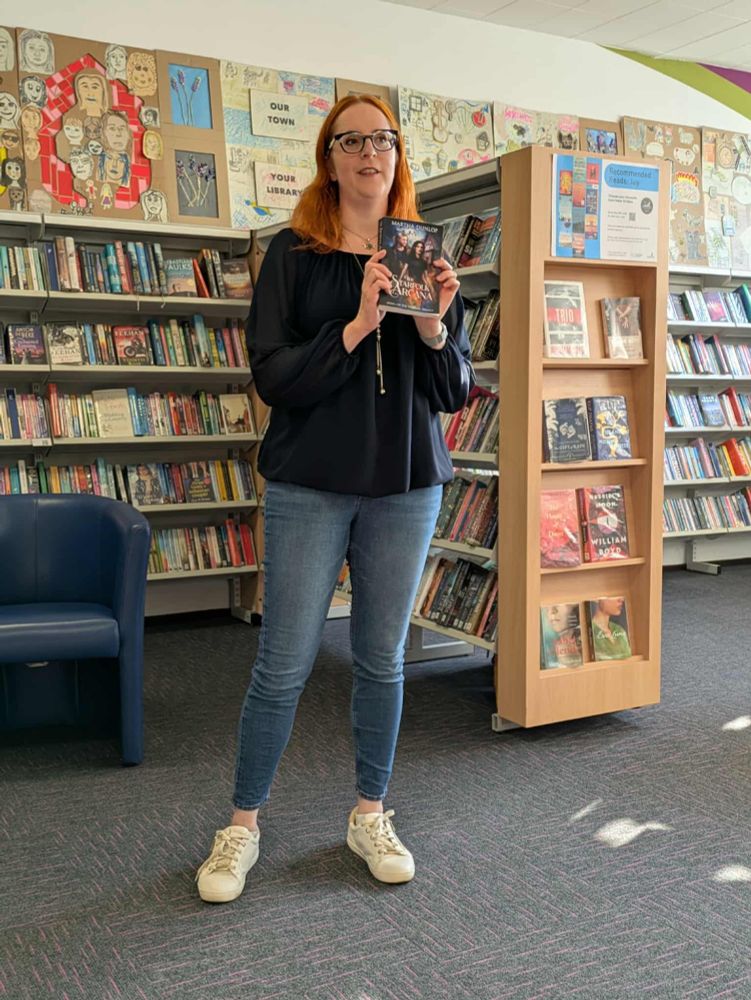Martha Dunlop with her novel, The Starfolk Arcana