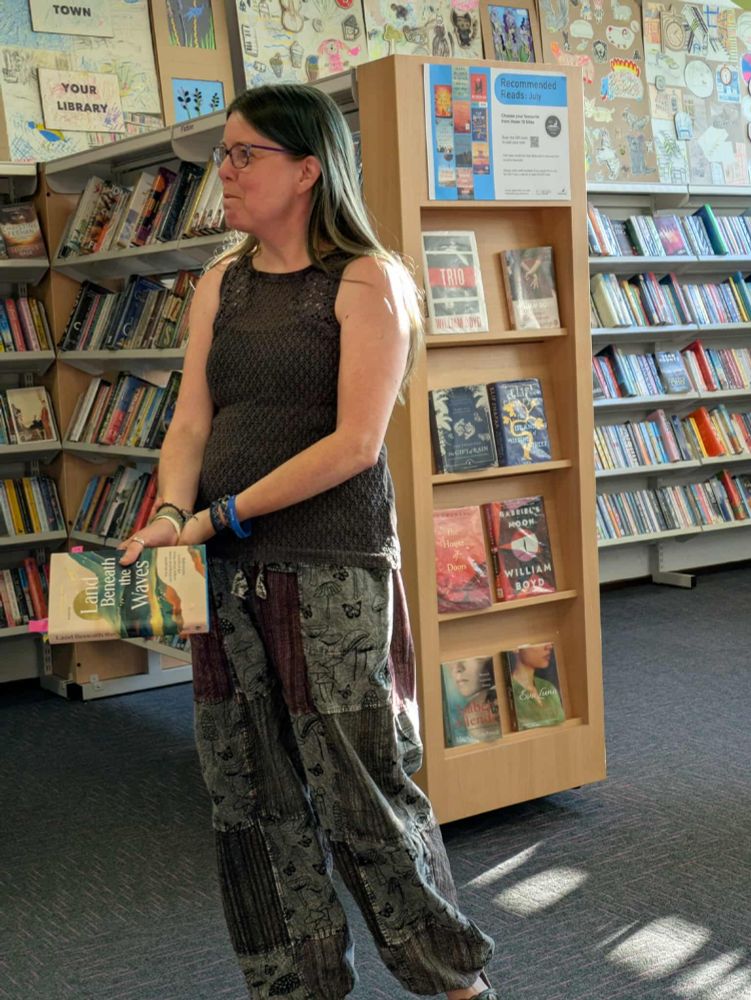 Nic Wilson with her book, Land Beneath The Waves