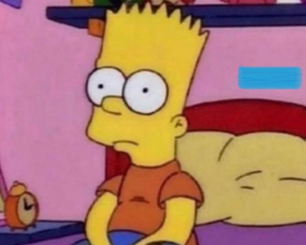 BART sitting on the edge of his bed staring off into space 