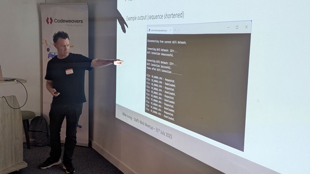Mike Irving explaining a program on screen