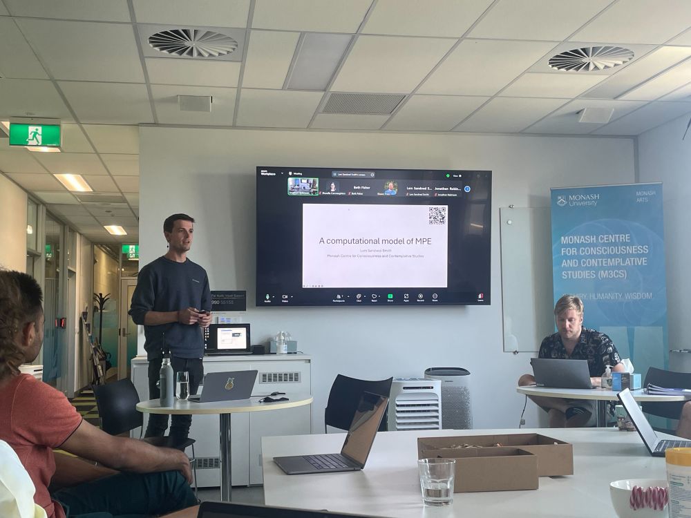 Lars Sandved-Smith giving a presentation