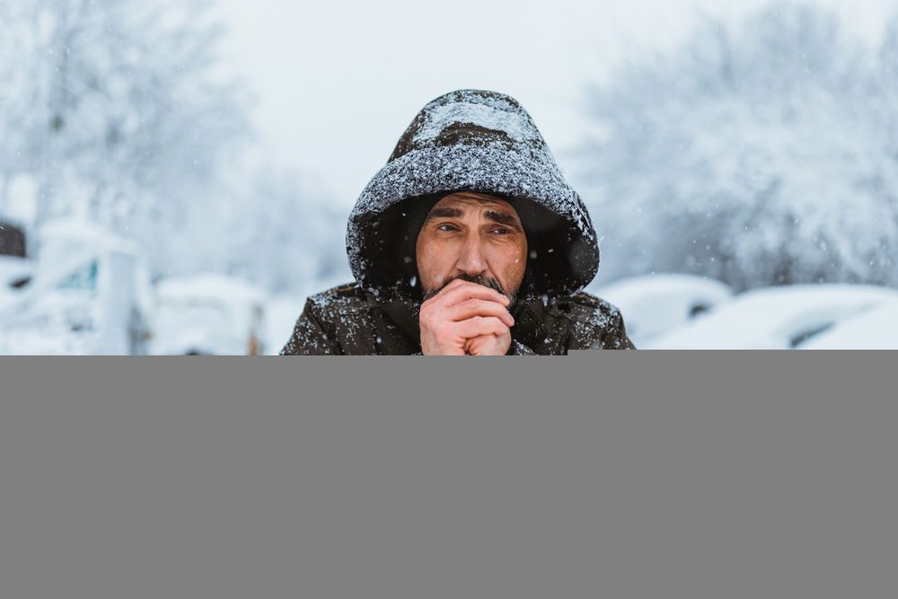 Stock image of man walking in snow