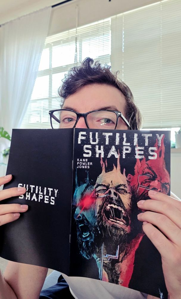 A comic book writer holding the first copy of their first ever comic!