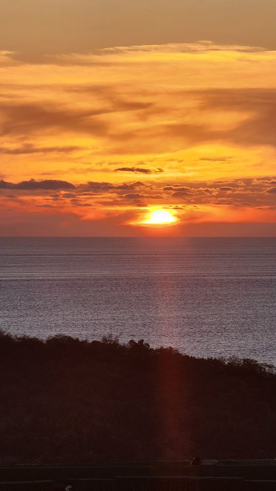 A beautiful red sky sunset over the pacific ocean.