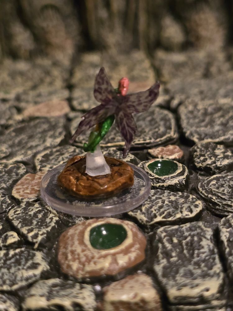 A back view of the Wisher Pixie's mini, showing off her translucent wings and slicked back pink hair.