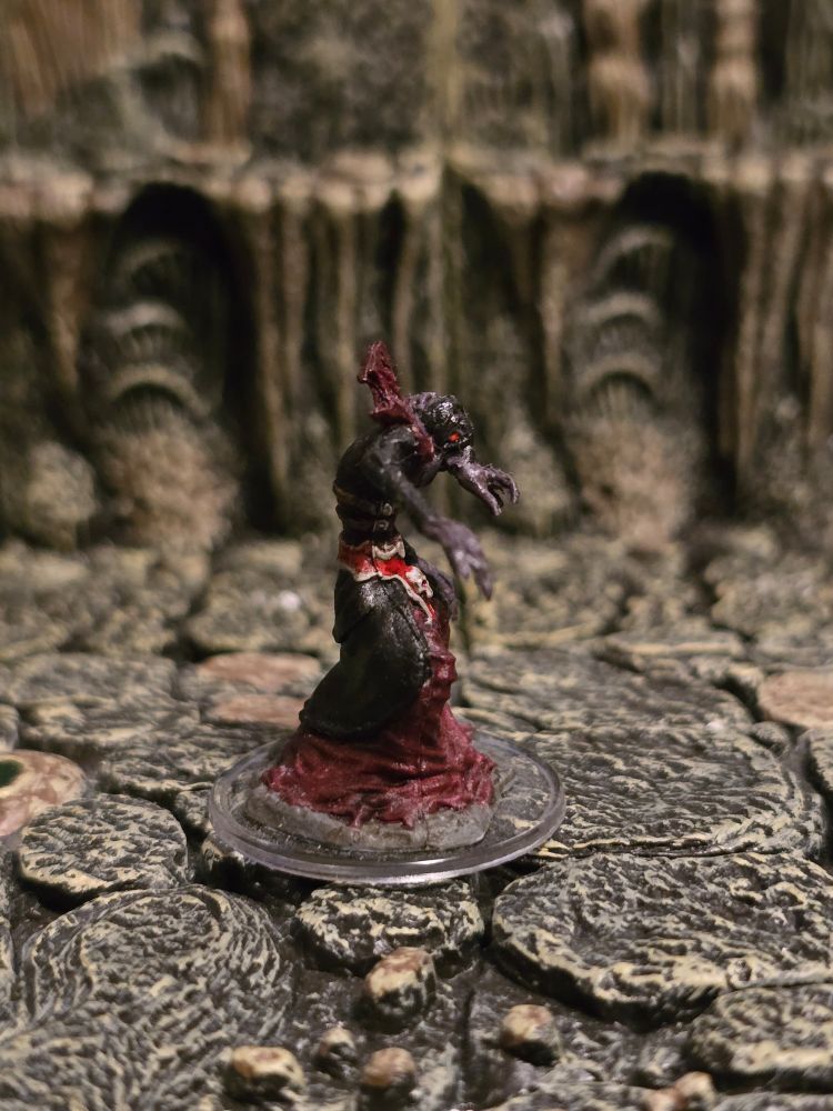 A side view of the Mind Flayer's mini, showing off their profile and pose.