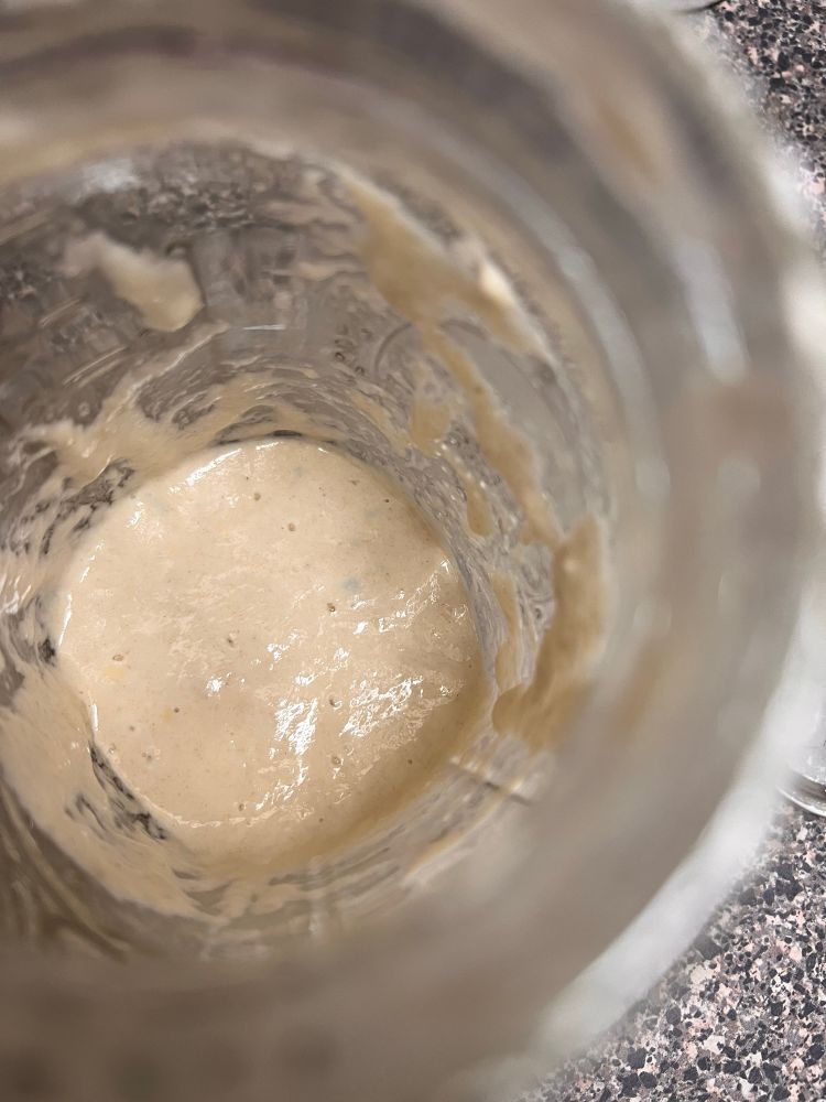 First sourdough starter with green spots 