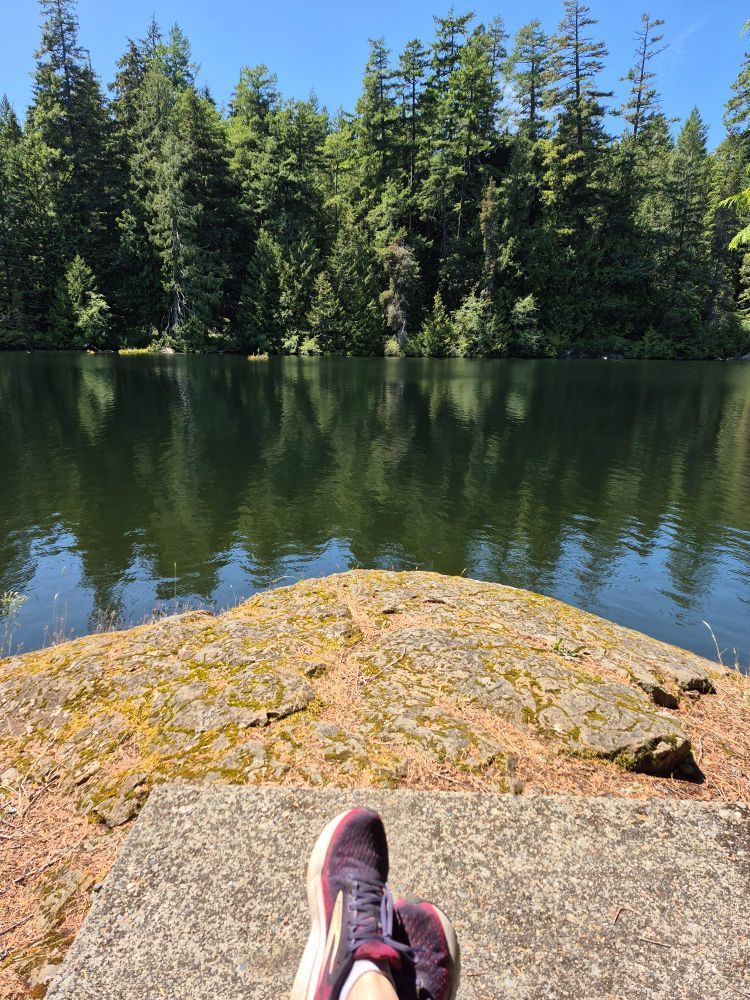 Jennifer sitting at a lake
