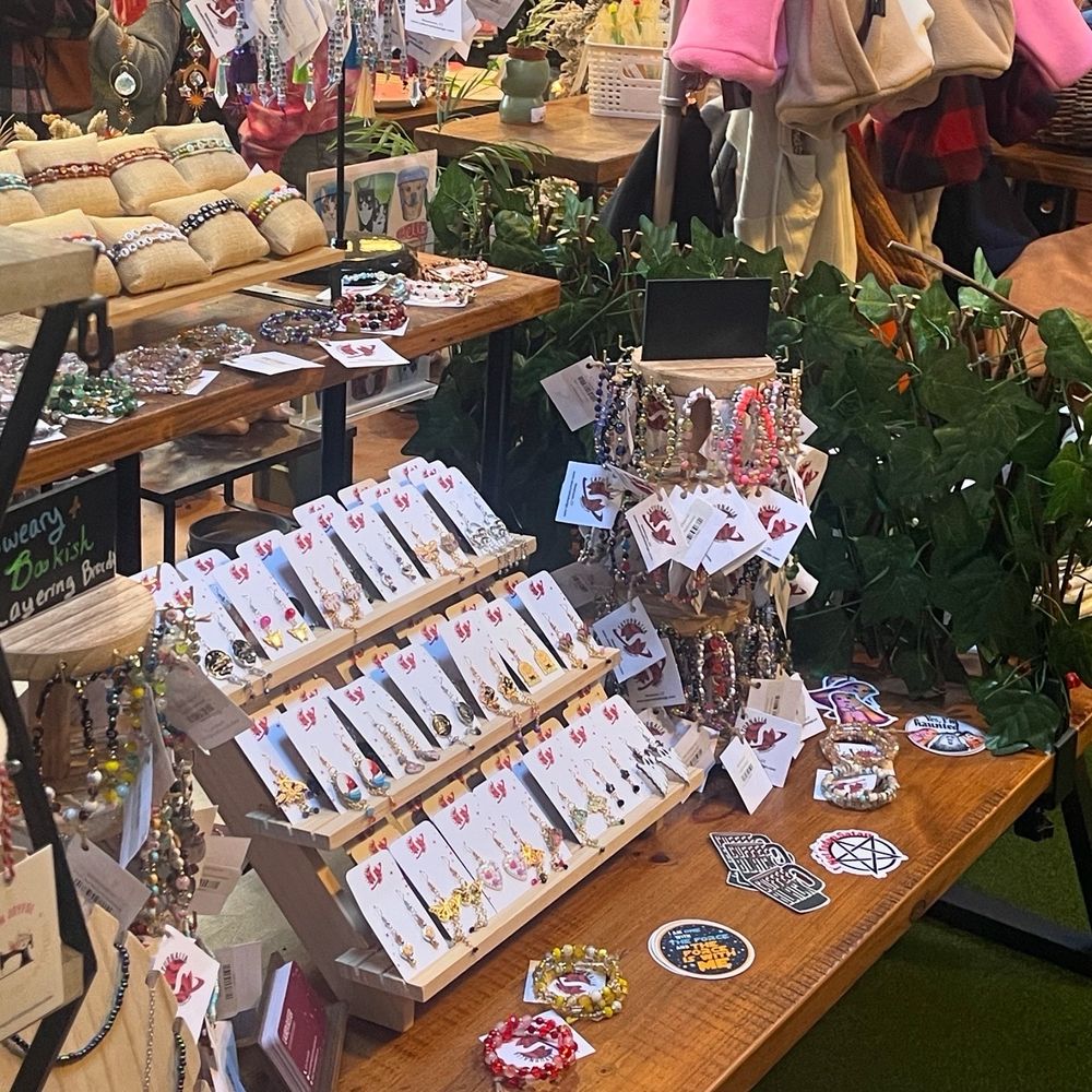 Photo of a fable full of jewelry and stickers.