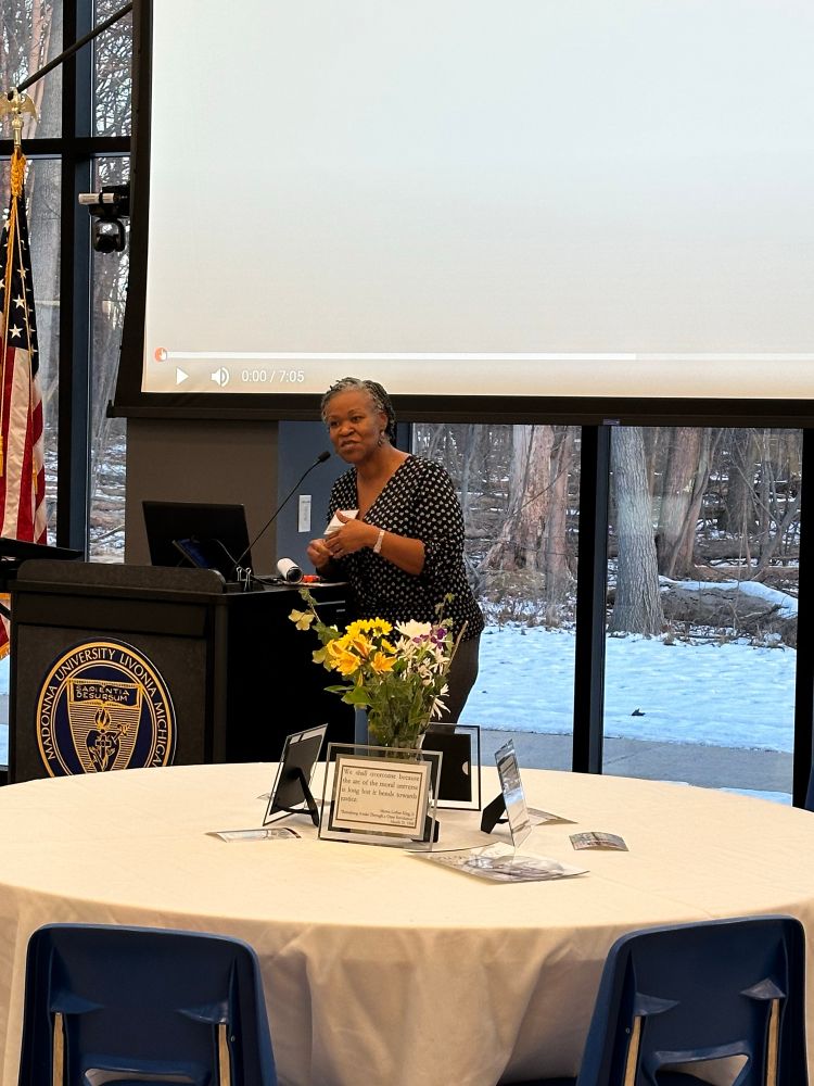 A woman standing at a podium.