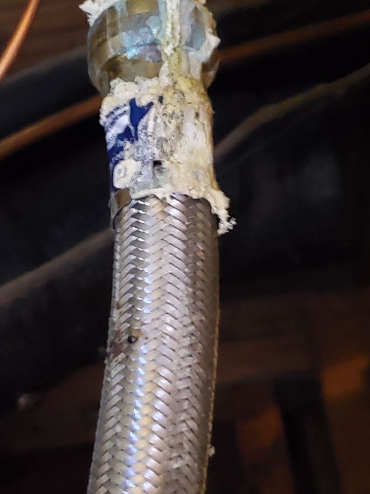 a more focussed shot of the lower corrosion. there's a drip along the side that would be where the drips fall from.