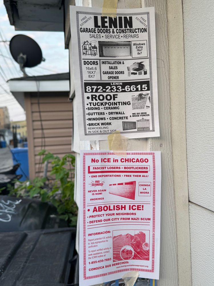 A flyer with red ink text/graphics in the style of those made by contractors selling their services, but with content about Abolishing ICE. It's taped to the side of a garage door and includes information about who to contact if you see ICE activity and links to Know Your Rights information. 

Above it is another flyer for a contractor named LENIN (!!). 