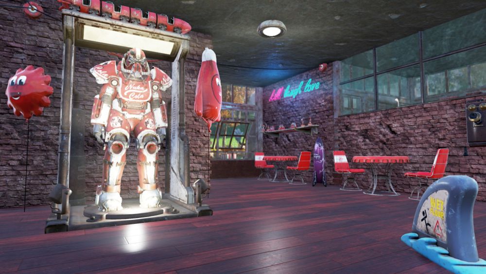 Another angle of the same corner, showing the intercom of the host stand on the wall. A wet floor shark fin sign, and a Nuka Cola T-51 display decked out with a Nuka Cola train, and Cappy & Bottle balloons.