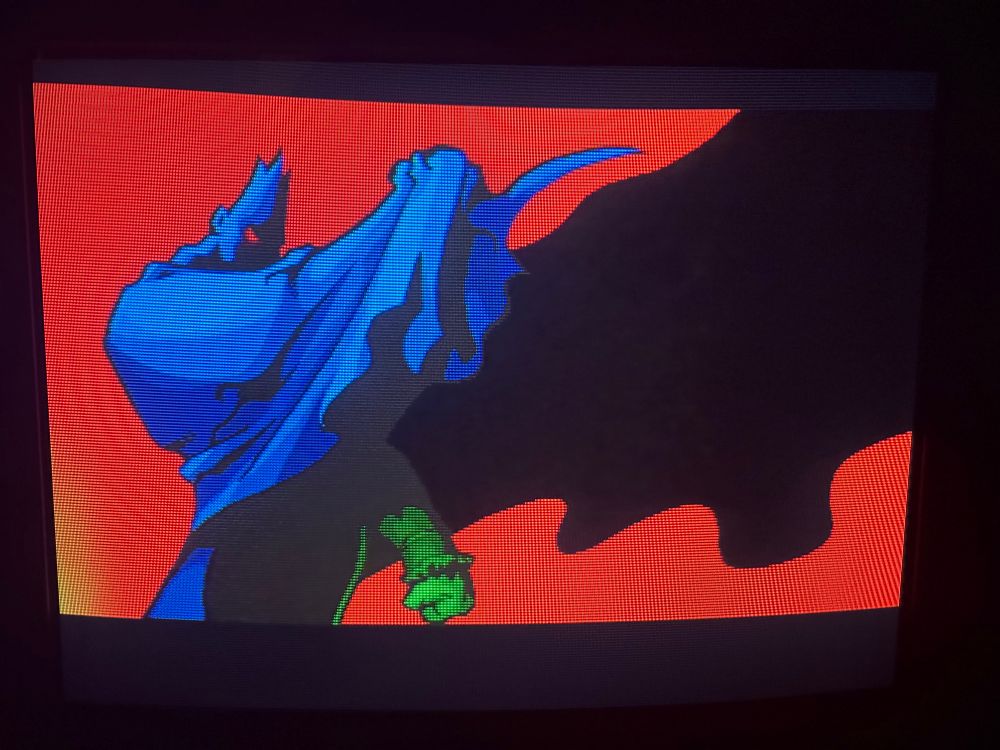 A picture of Vampire Savior on the KV-27V42 with the lower left corner showing some discoloration. The red background is displaying as yellow.