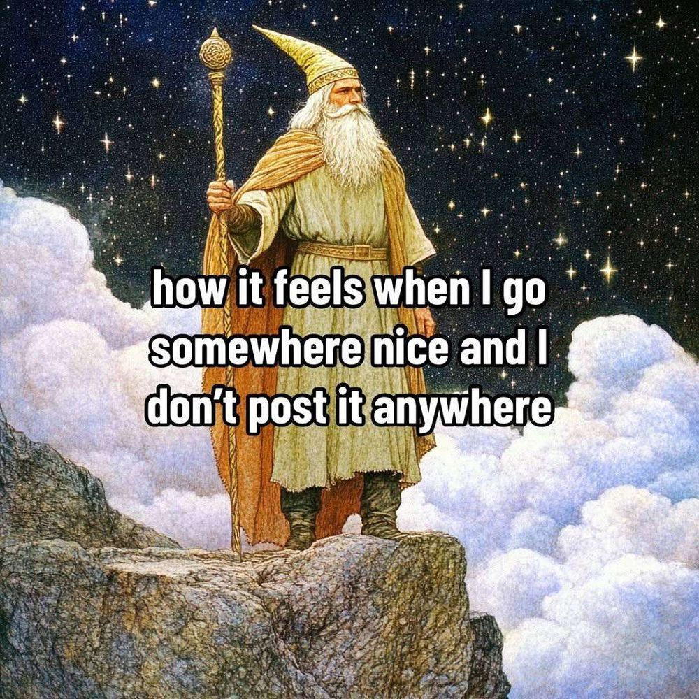 a wizard standing on a cliff surrounded by clouds with the text 'how it feels when i go somewhere nice and don't post about it anywhere'