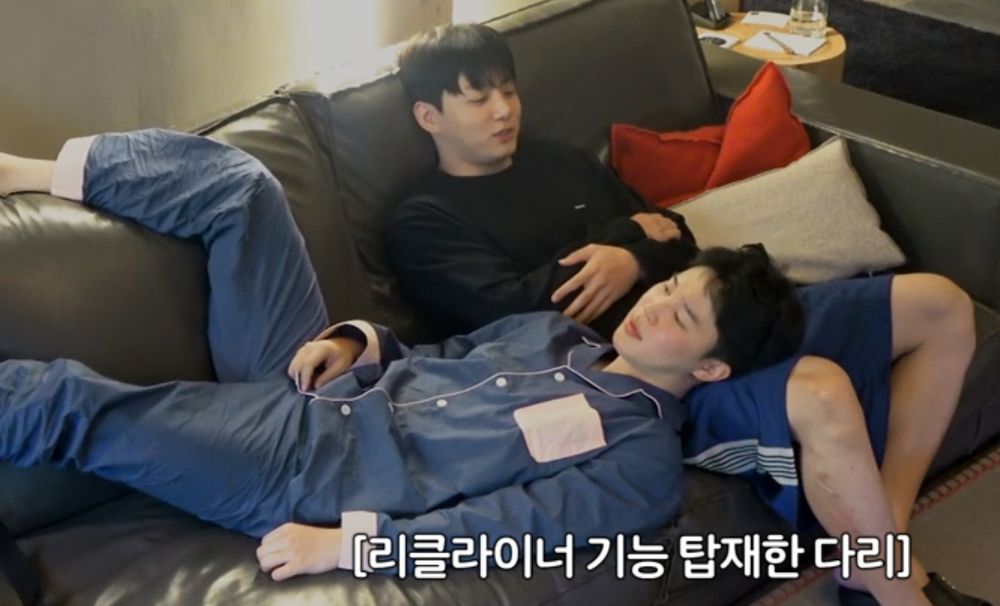A screenshot from Are You Sure 2 of Jimin, in his cutie pyjamas, lying with his HEAD IN JUNGKOOK'S LAP. This is so couple-y I can't you guys, my sanity is out the window and somewhere in the English Channel, they're so cute and this was not a momentary lap-lying incident he was there a WHILE and before that JK tried to put his head in Jimin's lap which apparently was not okay on camera, but Jimin can just lie there with his head cradled in his boyfie's lap while Jungkook smiles fondly at him and that's FINE crying forever.
