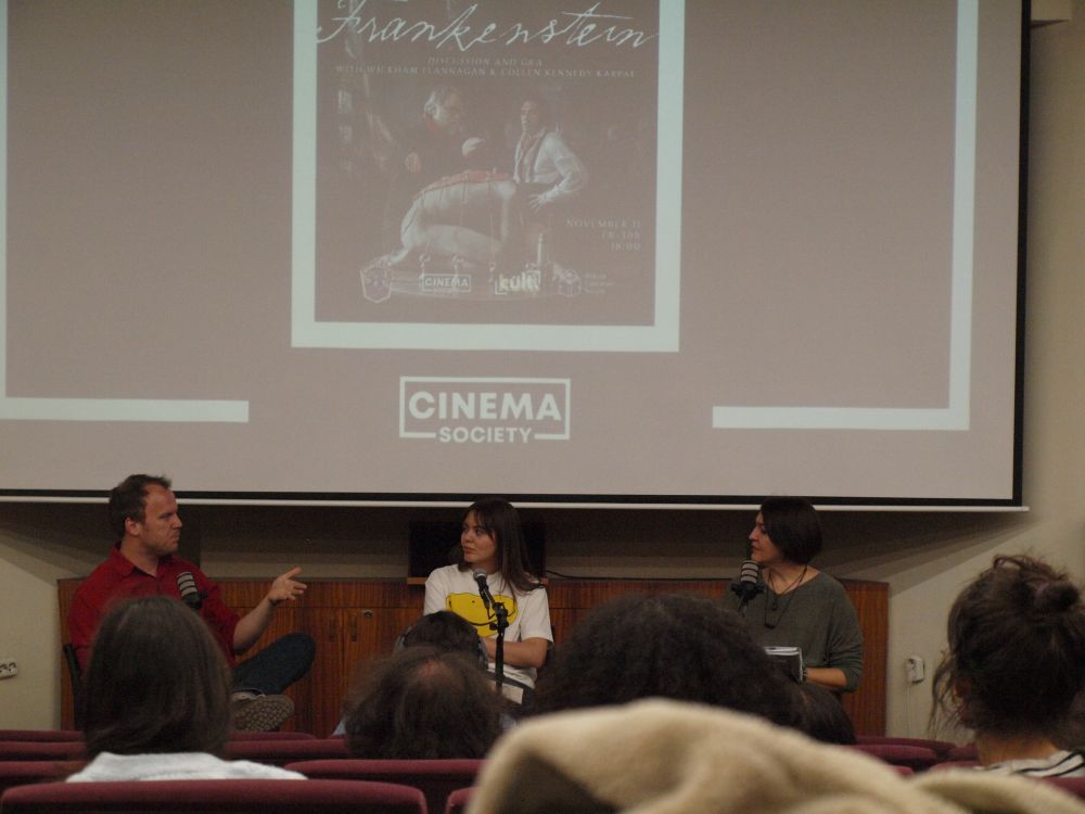 Co-hosts Wickham Flannagan, Ada Özduran, and Colleen Kennedy-Karpat in front of a live audience at Bilkent University discussing Guillermo Del Toro's new adaptation of FRANKENSTEIN.