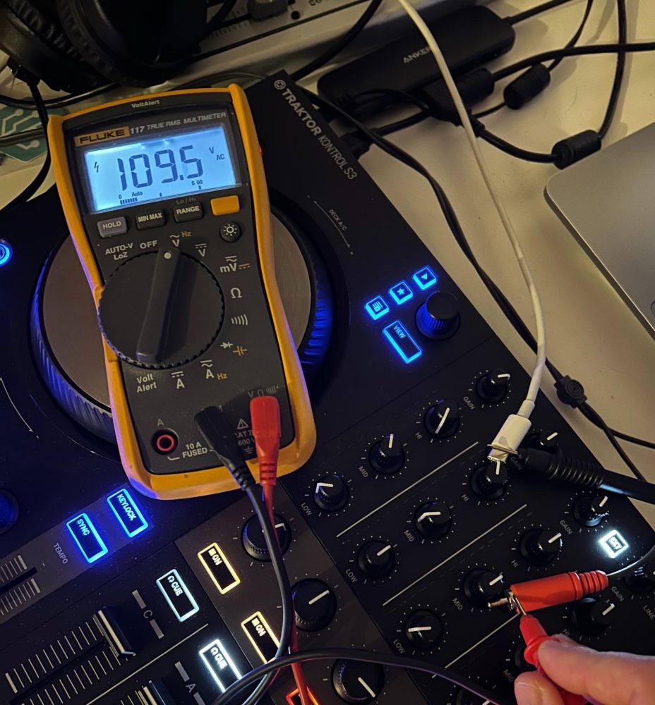 110V between ground of an audio plug and USB-C ground