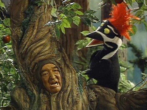 Actor Graham Greene as Mr. Crabby Tree from the Adventures of Dudley the Dragon. It was just a giant tree costume with his face in the trunk.