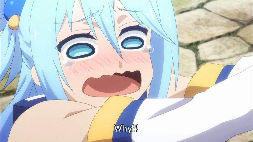 A close-up screenshot of the water goddess Aqua from the anime Konosuba crying and asking 