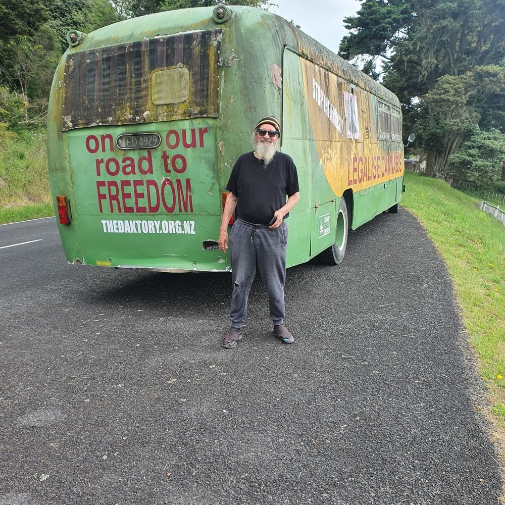 Dakta Green standing at the rear of Maryjane the Cannabus, which has seen better days.