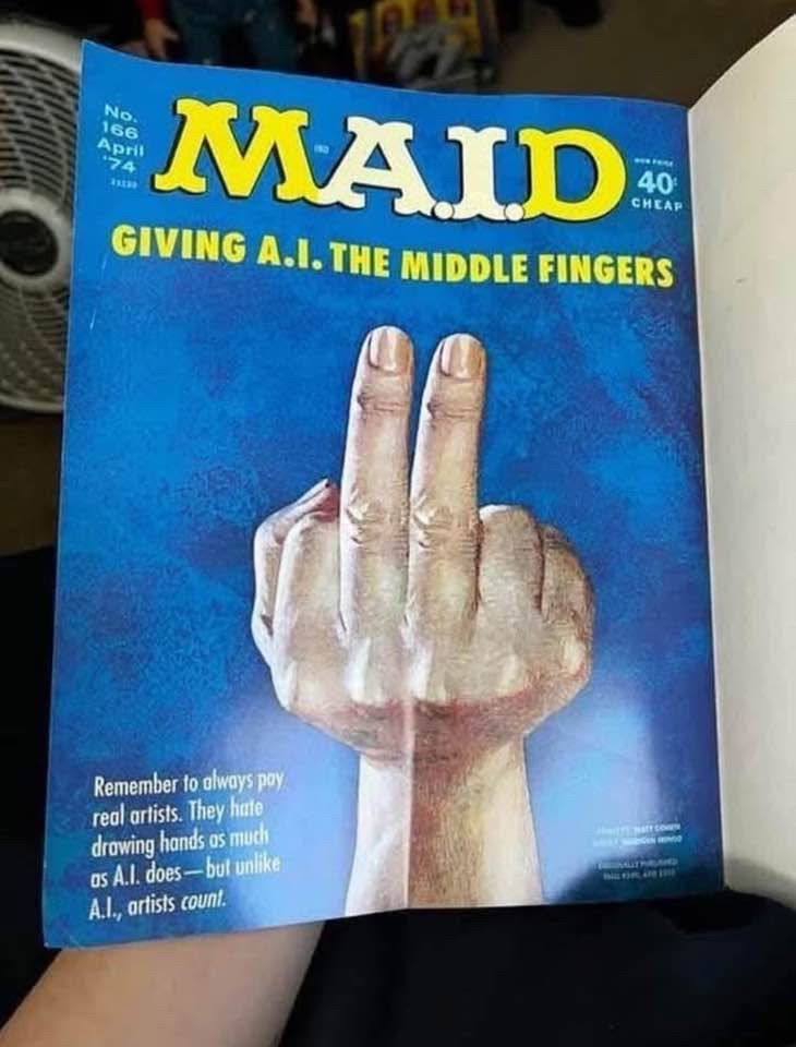 Modified cover of Mad magazine, headline “Giving A.I. the middle fingers” showing a six-fingered hand with the two middle ones raised.