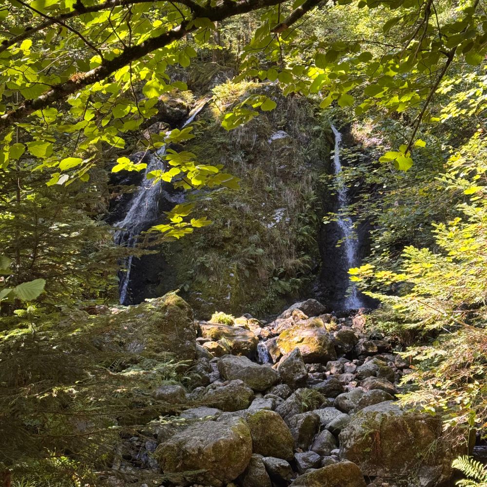 A small waterfall down a granite cliff