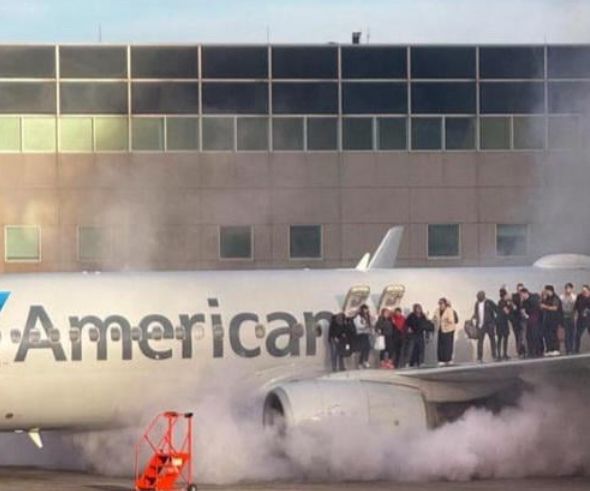 American Airlines flight on fire with people on the wing 